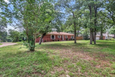Welcome to your serene retreat in the gated community of on Hide-A-Way Lake Golf Course in Texas - for sale on GolfHomes.com, golf home, golf lot