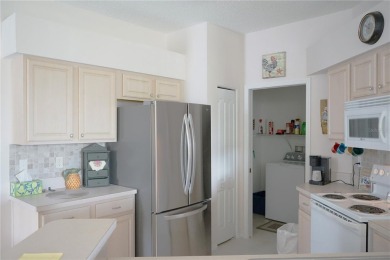 Original snow bird owners in this 2001 attached condo located in on Scepter Golf Club in Florida - for sale on GolfHomes.com, golf home, golf lot