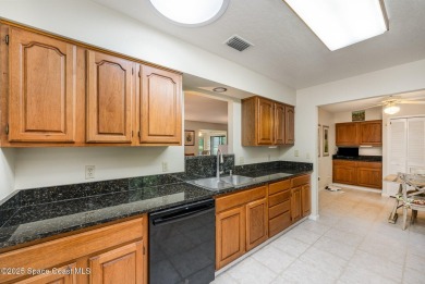 Beautiful expanded Raleigh model with water, golf course, and on Indian River Colony Club in Florida - for sale on GolfHomes.com, golf home, golf lot