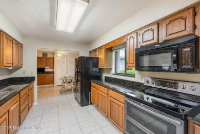 Beautiful expanded Raleigh model with water, golf course, and on Indian River Colony Club in Florida - for sale on GolfHomes.com, golf home, golf lot