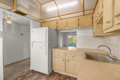 HANDYMAN SPECIAL!!! Golf and water view unit** Association on Oriole Golf and Tennis Club in Florida - for sale on GolfHomes.com, golf home, golf lot