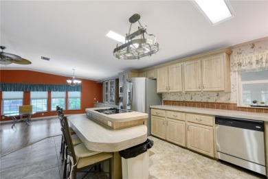 Spacious 2005 Triple-Wide Jacobsen built home situated on a 7 on Maple Leaf Golf and Country Club in Florida - for sale on GolfHomes.com, golf home, golf lot