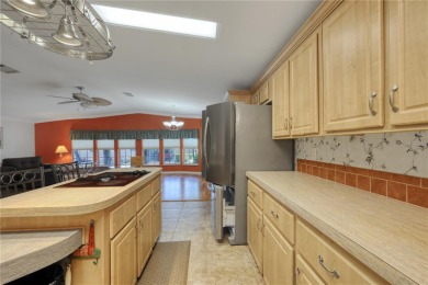 Spacious 2005 Triple-Wide Jacobsen built home situated on a 7 on Maple Leaf Golf and Country Club in Florida - for sale on GolfHomes.com, golf home, golf lot