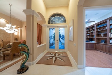 Sweeping water and fairway views abound in this custom-built on Boca Royale Golf and Country Club in Florida - for sale on GolfHomes.com, golf home, golf lot