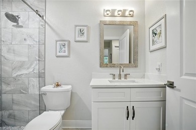 Stunning, completely remodeled end-unit first-floor coach home on West Bay Beach and Golf Club in Florida - for sale on GolfHomes.com, golf home, golf lot