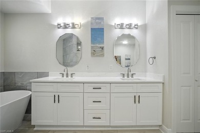 Stunning, completely remodeled end-unit first-floor coach home on West Bay Beach and Golf Club in Florida - for sale on GolfHomes.com, golf home, golf lot