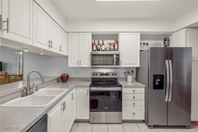 UPDATED main level CONDO with GOLF! Panoramic views of water on Golfview Golf and Racquet Club in Florida - for sale on GolfHomes.com, golf home, golf lot