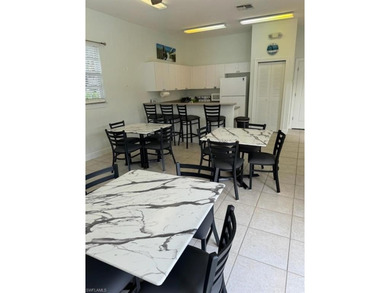 Stunning, completely remodeled end-unit first-floor coach home on West Bay Beach and Golf Club in Florida - for sale on GolfHomes.com, golf home, golf lot