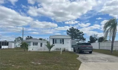 DISCOVER MOBILE GARDENS! Waterfront community with two boat on Oyster Creek Golf Club in Florida - for sale on GolfHomes.com, golf home, golf lot