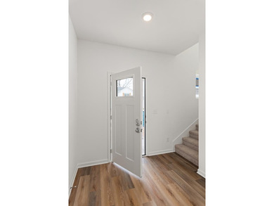 Primary on the main, open living space, 3 bedrooms up, AND a on Cookeville Golf  Club in Tennessee - for sale on GolfHomes.com, golf home, golf lot