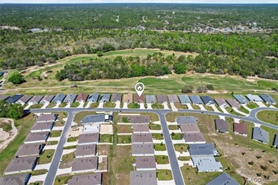 Scenically situated along the 10th hole tee of the highly on Twisted Oaks Golf Club in Florida - for sale on GolfHomes.com, golf home, golf lot
