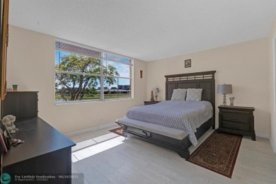 Backyard beauty! This so beautiful, light, bright condo home in on Marina Lakes Golf Course in Florida - for sale on GolfHomes.com, golf home, golf lot
