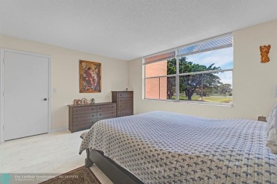 Backyard beauty! This so beautiful, light, bright condo home in on Marina Lakes Golf Course in Florida - for sale on GolfHomes.com, golf home, golf lot