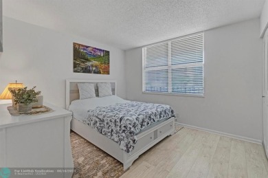 Backyard beauty! This so beautiful, light, bright condo home in on Marina Lakes Golf Course in Florida - for sale on GolfHomes.com, golf home, golf lot