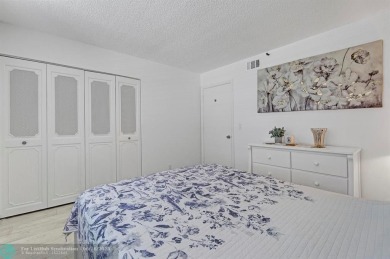 Backyard beauty! This so beautiful, light, bright condo home in on Marina Lakes Golf Course in Florida - for sale on GolfHomes.com, golf home, golf lot