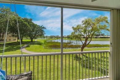 Backyard beauty! This so beautiful, light, bright condo home in on Marina Lakes Golf Course in Florida - for sale on GolfHomes.com, golf home, golf lot