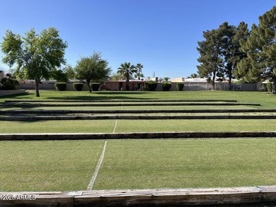 Imagine peaceful mornings on your wrap-around patio, surrounded on Sun Lakes Country Club in Arizona - for sale on GolfHomes.com, golf home, golf lot