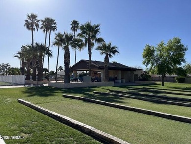 Imagine peaceful mornings on your wrap-around patio, surrounded on Sun Lakes Country Club in Arizona - for sale on GolfHomes.com, golf home, golf lot