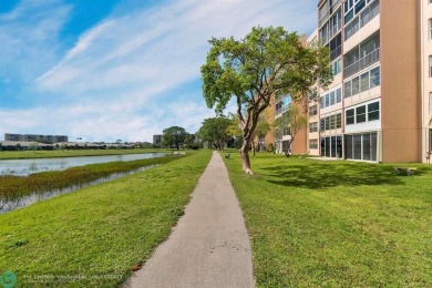 Backyard beauty! This so beautiful, light, bright condo home in on Marina Lakes Golf Course in Florida - for sale on GolfHomes.com, golf home, golf lot