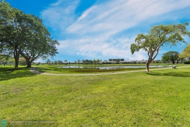 Backyard beauty! This so beautiful, light, bright condo home in on Marina Lakes Golf Course in Florida - for sale on GolfHomes.com, golf home, golf lot
