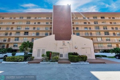 Backyard beauty! This so beautiful, light, bright condo home in on Marina Lakes Golf Course in Florida - for sale on GolfHomes.com, golf home, golf lot