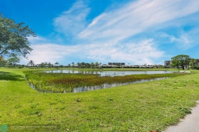 Backyard beauty! This so beautiful, light, bright condo home in on Marina Lakes Golf Course in Florida - for sale on GolfHomes.com, golf home, golf lot