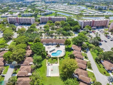 Backyard beauty! This so beautiful, light, bright condo home in on Marina Lakes Golf Course in Florida - for sale on GolfHomes.com, golf home, golf lot