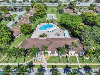 Backyard beauty! This so beautiful, light, bright condo home in on Marina Lakes Golf Course in Florida - for sale on GolfHomes.com, golf home, golf lot