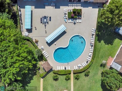 Backyard beauty! This so beautiful, light, bright condo home in on Marina Lakes Golf Course in Florida - for sale on GolfHomes.com, golf home, golf lot
