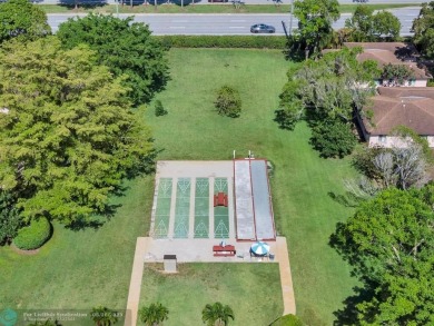 Backyard beauty! This so beautiful, light, bright condo home in on Marina Lakes Golf Course in Florida - for sale on GolfHomes.com, golf home, golf lot