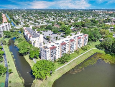 Backyard beauty! This so beautiful, light, bright condo home in on Marina Lakes Golf Course in Florida - for sale on GolfHomes.com, golf home, golf lot