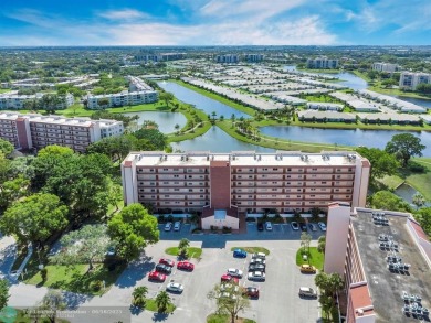 Backyard beauty! This so beautiful, light, bright condo home in on Marina Lakes Golf Course in Florida - for sale on GolfHomes.com, golf home, golf lot