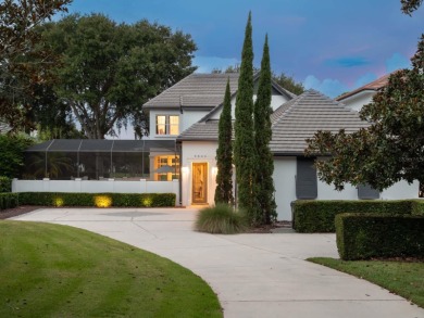 This private, tucked-away residence is perfectly located on the on Lake Nona Golf Club, Inc. in Florida - for sale on GolfHomes.com, golf home, golf lot