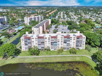 Backyard beauty! This so beautiful, light, bright condo home in on Marina Lakes Golf Course in Florida - for sale on GolfHomes.com, golf home, golf lot
