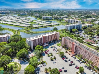Backyard beauty! This so beautiful, light, bright condo home in on Marina Lakes Golf Course in Florida - for sale on GolfHomes.com, golf home, golf lot