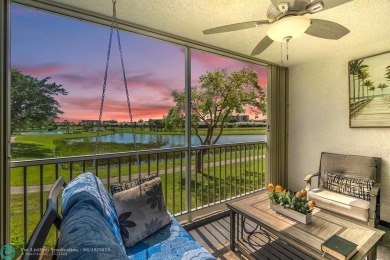 Backyard beauty! This so beautiful, light, bright condo home in on Marina Lakes Golf Course in Florida - for sale on GolfHomes.com, golf home, golf lot