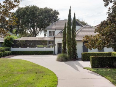 This private, tucked-away residence is perfectly located on the on Lake Nona Golf Club, Inc. in Florida - for sale on GolfHomes.com, golf home, golf lot