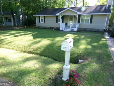 Precious home on level lot with spacious family room anchored by on Golf Club of Macon in Georgia - for sale on GolfHomes.com, golf home, golf lot