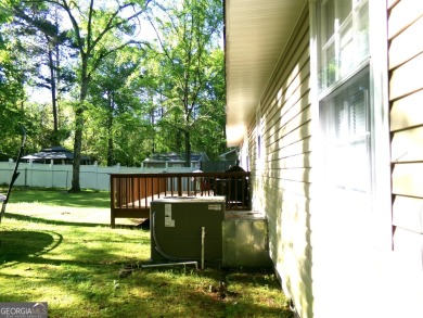 Precious home on level lot with spacious family room anchored by on Golf Club of Macon in Georgia - for sale on GolfHomes.com, golf home, golf lot