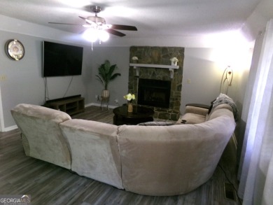 Precious home on level lot with spacious family room anchored by on Golf Club of Macon in Georgia - for sale on GolfHomes.com, golf home, golf lot