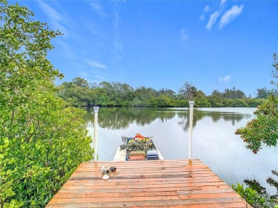This waterfront property truly presents an incredible on Gulf Harbors Golf Course in Florida - for sale on GolfHomes.com, golf home, golf lot