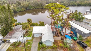 This waterfront property truly presents an incredible on Gulf Harbors Golf Course in Florida - for sale on GolfHomes.com, golf home, golf lot