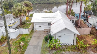 This waterfront property truly presents an incredible on Gulf Harbors Golf Course in Florida - for sale on GolfHomes.com, golf home, golf lot