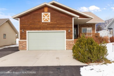 This well-kept, cedar-sided custom home on the golf course in on Star Valley RV Golf Course in Wyoming - for sale on GolfHomes.com, golf home, golf lot