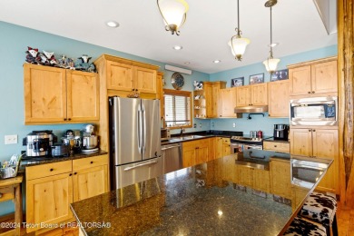 This well-kept, cedar-sided custom home on the golf course in on Star Valley RV Golf Course in Wyoming - for sale on GolfHomes.com, golf home, golf lot