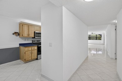 Welcome to your upgraded lakeside 2-bed, 2-bath condo with on Sunrise Lakes Phase III in Florida - for sale on GolfHomes.com, golf home, golf lot