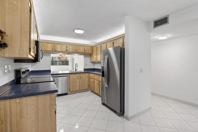 Welcome to your upgraded lakeside 2-bed, 2-bath condo with on Sunrise Lakes Phase III in Florida - for sale on GolfHomes.com, golf home, golf lot