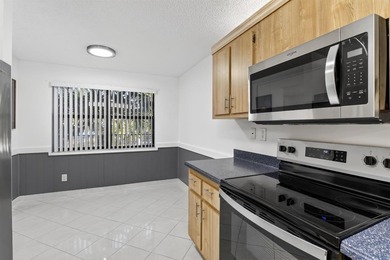 Welcome to your upgraded lakeside 2-bed, 2-bath condo with on Sunrise Lakes Phase III in Florida - for sale on GolfHomes.com, golf home, golf lot