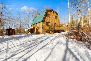 Charming 5-bedroom home located on a peaceful, tree-lined street on Cedar Creek Golf Course in Wyoming - for sale on GolfHomes.com, golf home, golf lot