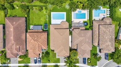 Exquisite two-story pool home, nestled in the prestigious on Parkland Golf Club in Florida - for sale on GolfHomes.com, golf home, golf lot